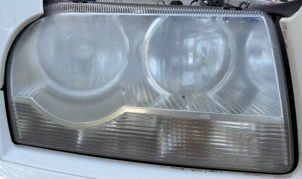 Reference photo of a faded headlight with mild haze