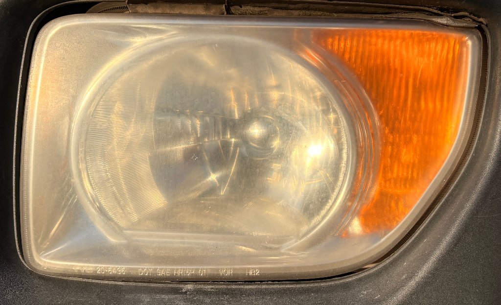 Reference photo of a yellowed headlight with moderate oxidation